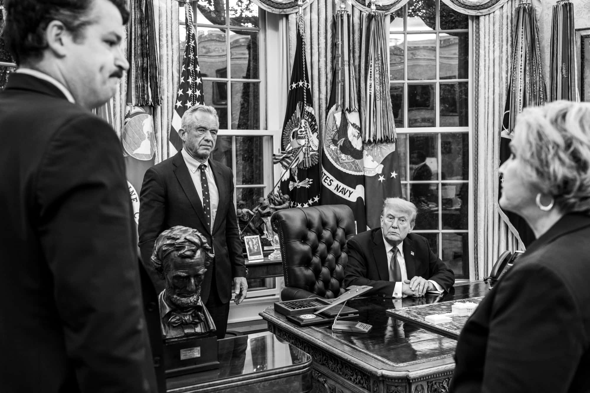 Trump at the Resolute Desk with RFK Jr. standing beside him in the Oval Office